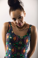 Cute young lady posing against grey background