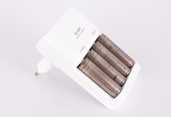 isolated of the AA battery with charger is energy refill on whit