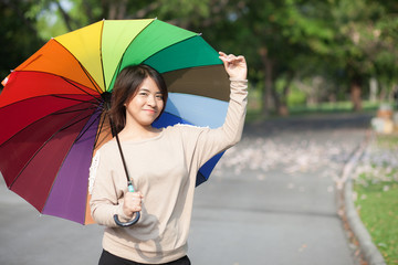 Women holding umbrella
