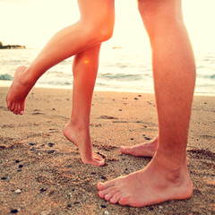 Fototapeta na wymiar Kissing lovers - couple on beach love concept