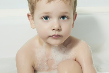 Little Boy in the Bath.Funny Child in Foam
