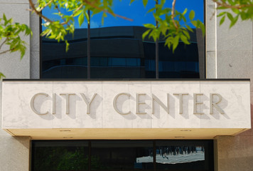 Fototapeta na wymiar City Center sign over the entrance to a small city hall