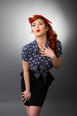 Pin up girl blowing a kiss