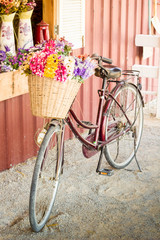 Fototapeta na wymiar Vintage bicycle with flower in basket