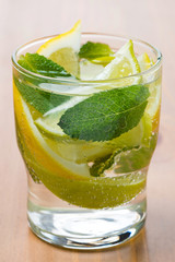 Cold fresh lemonade with lemon, lime and mint, close-up