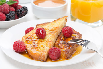 French toast with raspberries and honey for breakfast, close-up