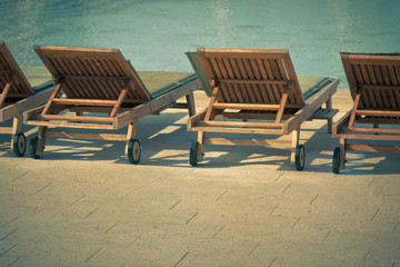 Fototapeta premium Hotel Poolside Chairs with Sea view