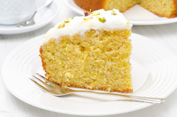 piece of orange cake with Greek yogurt, honey and pistachios