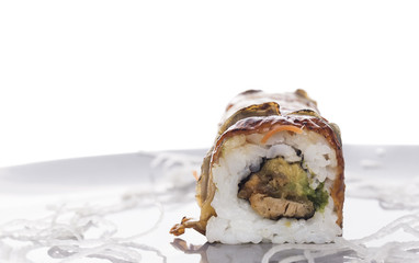 sushi roll with smoked eel , isolated