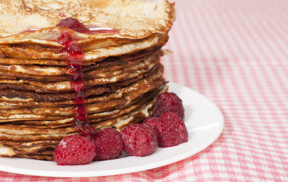Pancakes with raspberry jam.