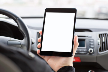 man sitting in the car and holding a tablet with isolated screen