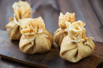 Close-up of homemade crepes with stuffing, horizontal shot