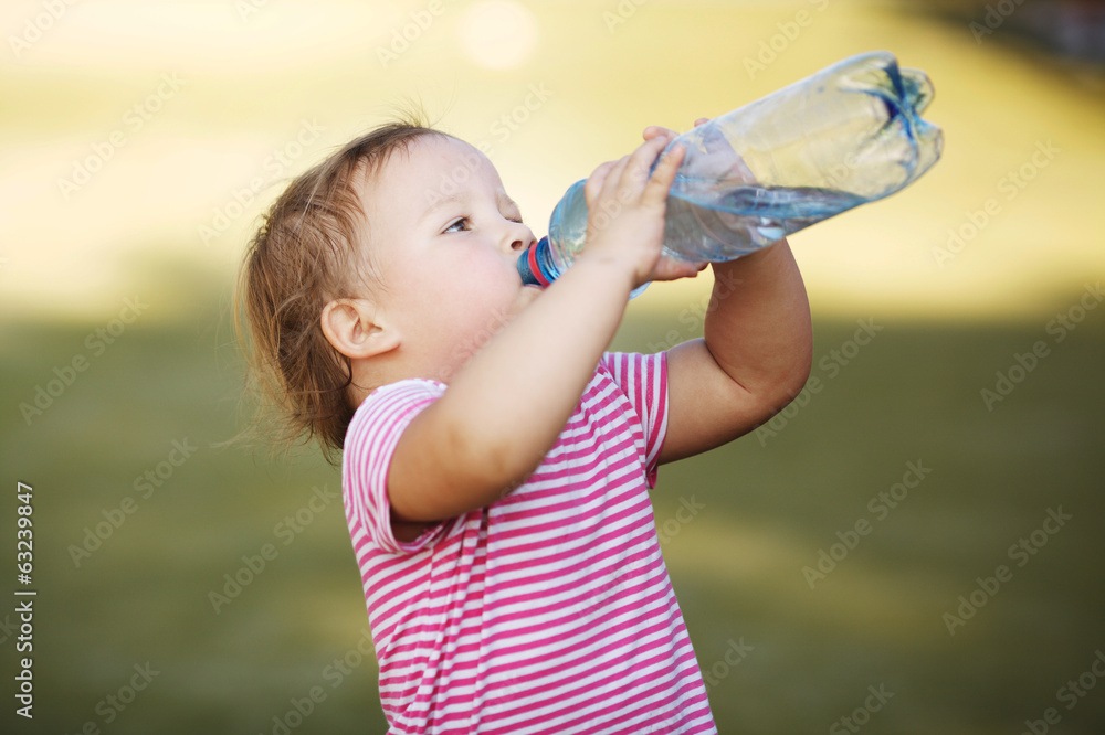 Wall mural girl with bottle of mineral water