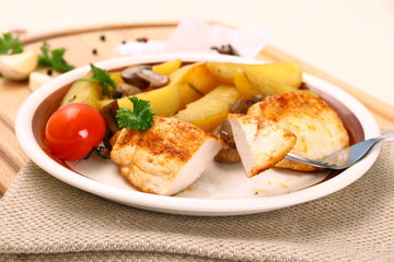 Chicken fillet, mushroom, rosemary potatoes, close up