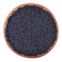 Black raw lentil in a wooden bowl on a white