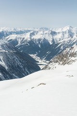 Fototapeta na wymiar Alpine valley surrounded with mountains