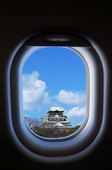 travel Japan, view of window aircraft with Osaka castle