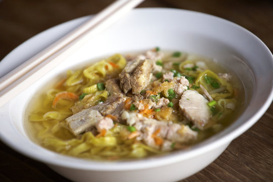 yellow pork noodle and sweet soup in thai food