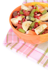 Sweet fresh fruits in bowl on table close-up