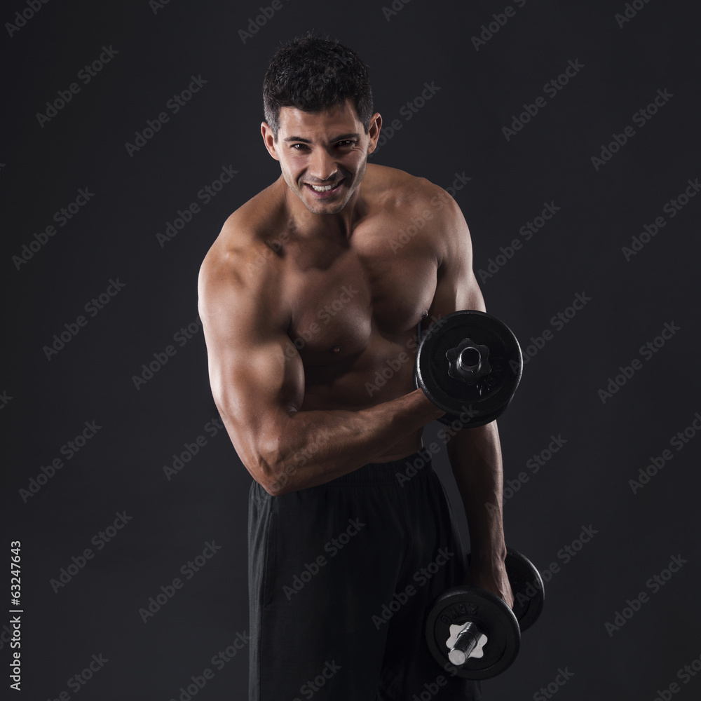 Wall mural Muscular man lifting weights