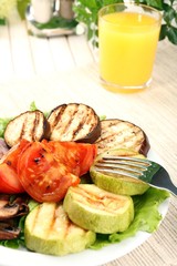 Delicious grilled vegetables on plate on table close-up