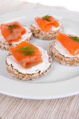Delicious canapes on plate close-up