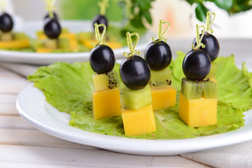 Delicious canapes on table close-up