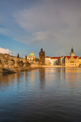Fototapeta na wymiar View from Kampa on the famous Charles Bridge at spring sunset.
