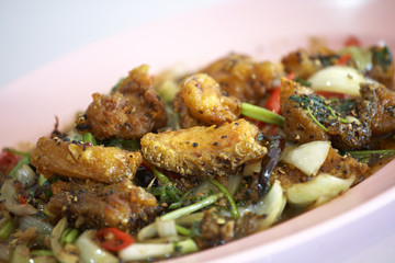 spicy salmon fried with herb in thai food