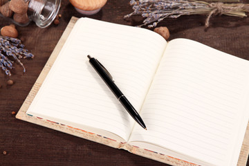 Blank recipe book on wooden background