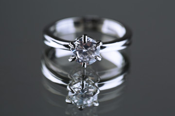 Beautiful diamond ring on gray background