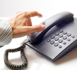 The businessman calling by phone.