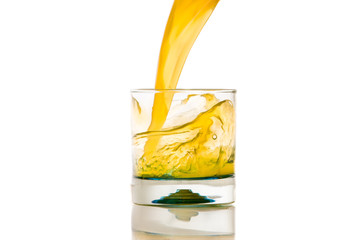 pouring orange juice splash on a white background