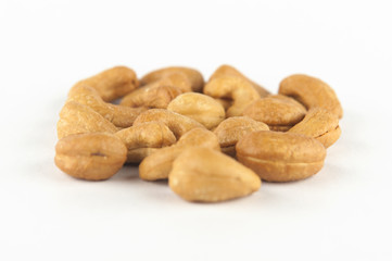 Roasted cashew nuts on white background