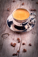 cup of Coffee on wooden vintage table