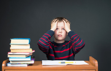 Boy Having Problems With His Homework. Panic