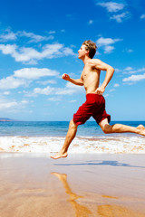 Fototapeta na wymiar Athletic Man Running on Beach