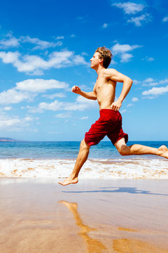 Athletic Man Running on Beach