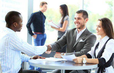 Business people shaking hands, finishing up a meeting