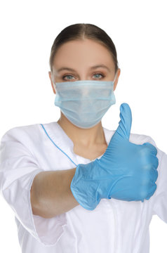 Doctor in mask and gloves with gesture OK