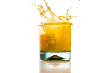 Fototapeta na wymiar pouring orange juice splash on a white background