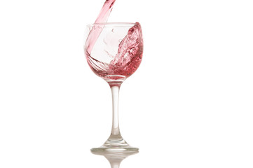 wine and a glass pouring on a white background
