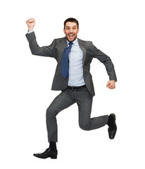 smiling businessman jumping