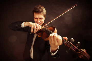 Man violinist playing violin. Classical music art