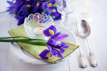 table setting with purple iris flowers