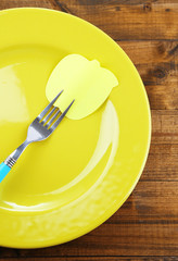 Empty note paper attached to fork,