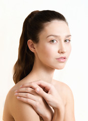 Beautiful young adult woman with clean fresh skin