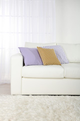 White leather sofa in room
