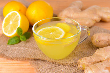 Healthy ginger tea with lemon and honey on table close-up