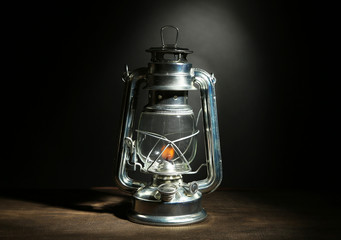 Kerosene lamp on dark grey background